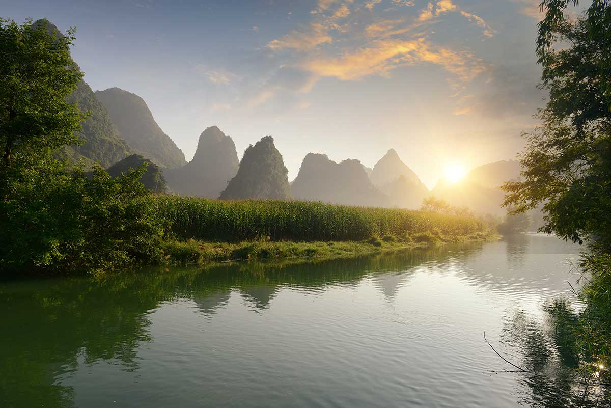 Chinese entry stamps and visa pages in an open passport.