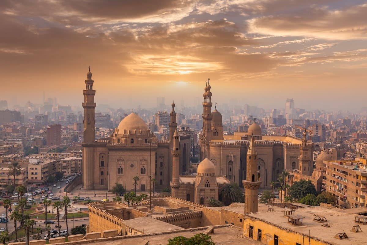 Sunset over the Sultan Hassan and Al-Rifa'i mosques from the Cairo Citadel viewpoint.