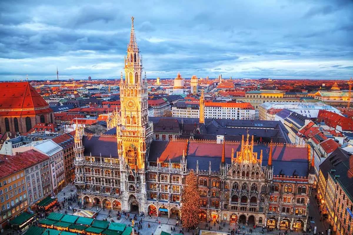 Aerial view of Munich's historic Marienplatz square with the illuminated neo-Gothic New Town Hall tower and Christmas market