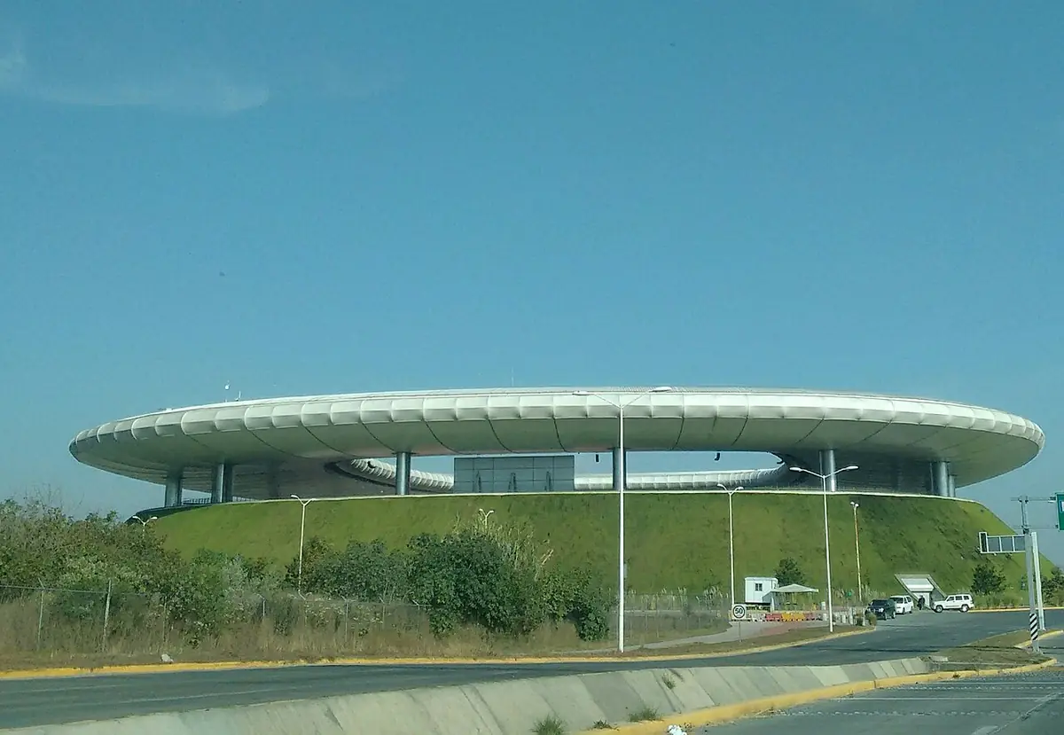 Estadio Akron's grass-covered slope rising outside Guadalajara.