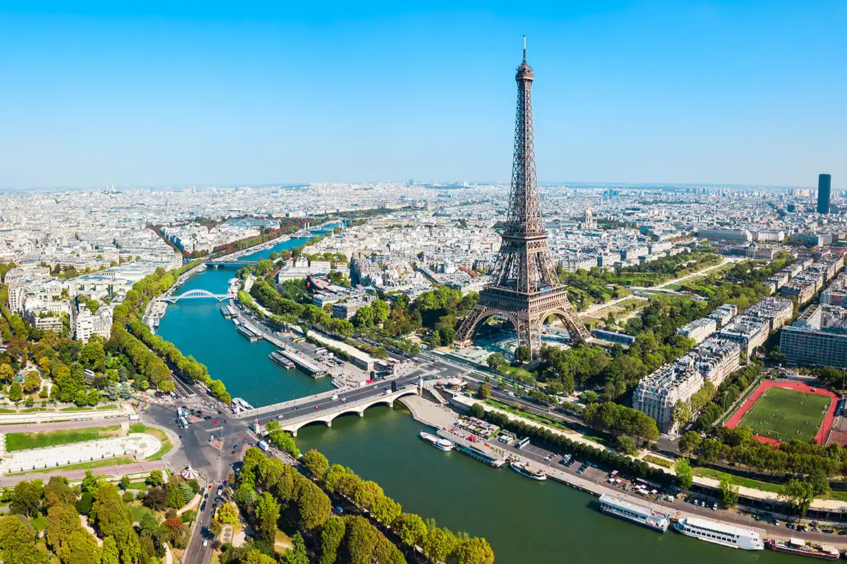 The Eiffel Tower rising above Paris rooftops.